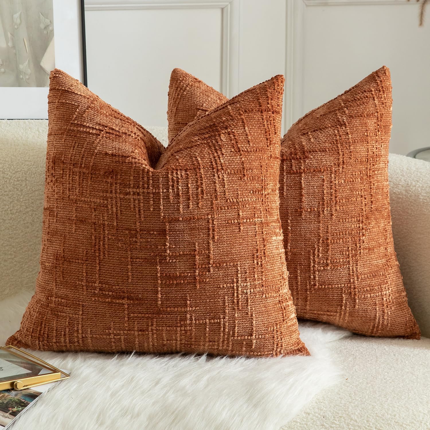 two textured throw pillows burnt brick tone